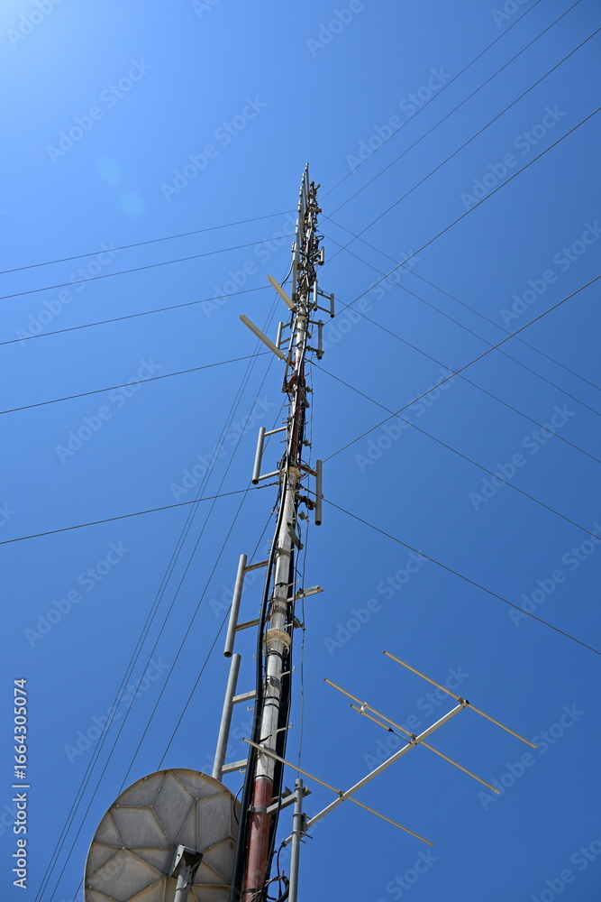 5G mobile phone antennas on tall blue masts 5G mobile phone antennas on tall blue masts