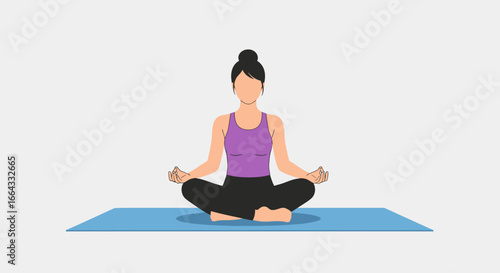 Woman practicing yoga in a seated meditation pose on a yoga mat.