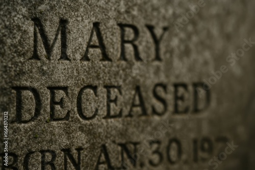 Gravestone Close-Up Showing Name And Deceased Inscription In Stone Texture