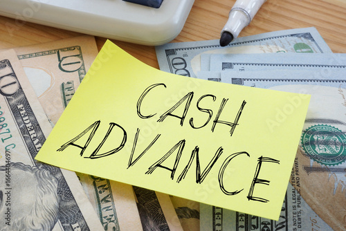 Cash advance is shown using the text and photo of dollars as business and financial concept