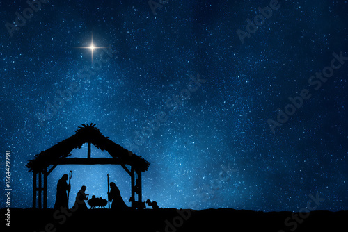 Elegant black silhouettes of the Christmas Nativity scene against a magnificent starry night sky backdrop symbolizing the holy night
