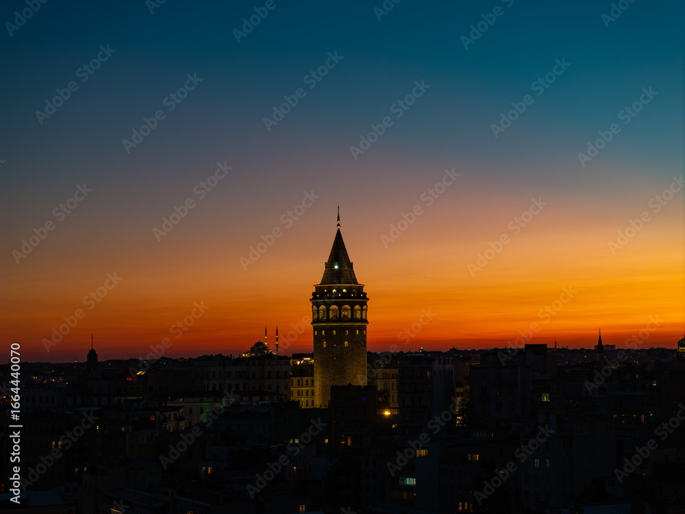 Fototapeta premium Iconic Galata Tower in the Sunset Lights Drone Photo, Galata Beyoglu, Istanbul Turkiye (Turkey)