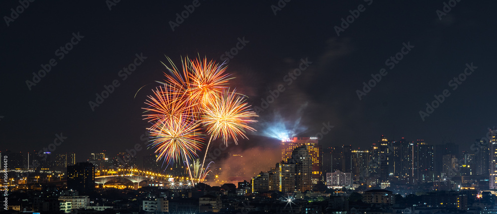 Blurred background of night lights in Bangkok. Fireworks, traffic lights, lights on bridges over the river, the spread of electric lighting technology in homes. Blurred background of night lights in Bangkok. Fireworks, traffic lights, lights on bridges over the river, the spread of electric lighting technology in homes.