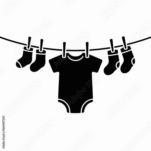 Baby Clothes Hanging on Line