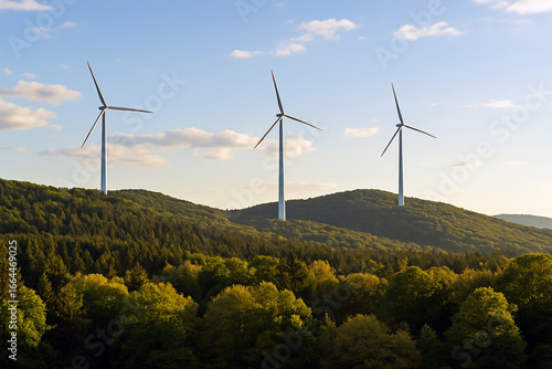 Peaceful landscape with green forest and modern wind turbines on sunny hills under clear sky, eco-friendly energy concept in harmony with nature.