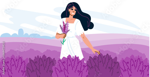 Woman walking in lavender field holding bouquet of flowers