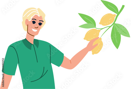 Farmer holding branch with ripe lemons, smiling and looking aside during harvesting in orchard