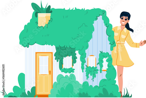 Woman presenting eco friendly house covered by green plants
