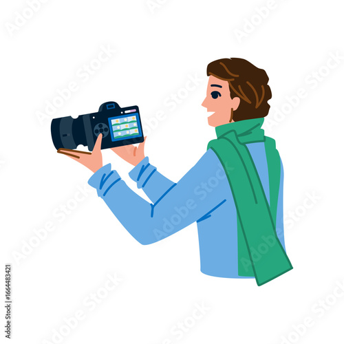 Photographer reviewing photos on camera screen, smiling and enjoying work
