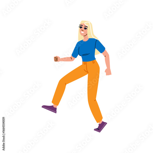 Young blonde woman walking and smiling stylishly dressed