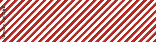 Red and white diagonal striped banner. Candy cane inspired design with festive holiday mood. Bright abstract texture with attention signal style for Christmas, decor, and creative projects.