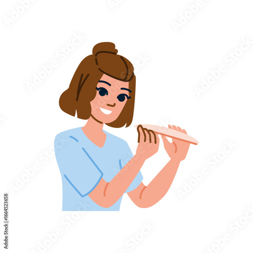 Beautician filing nails with nail file for manicure treatment