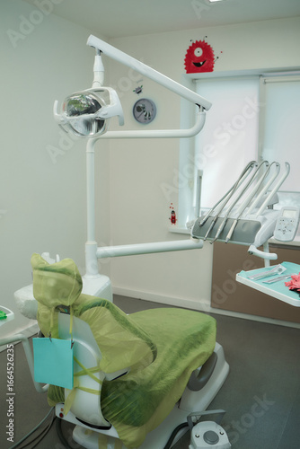 A well-lit and clean dentist's office, featuring dental equipment and a welcoming atmosphere.