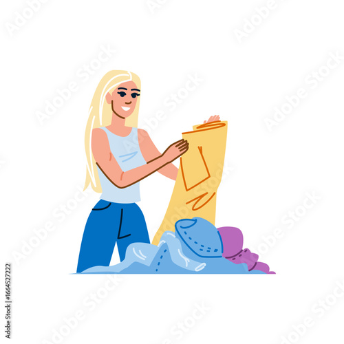 Seamstress holding sewing pattern and examining clothes to mend