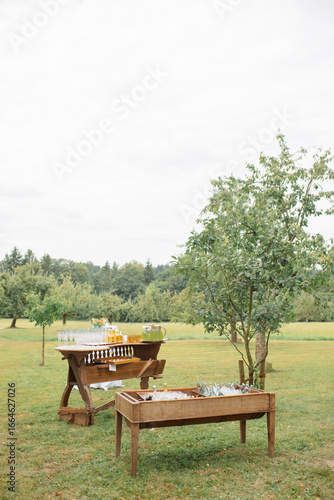 Obraz na płótnie Rustic Outdoor Drink Station with Wooden Tables