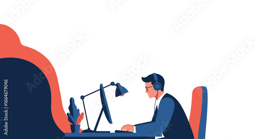 Focused professional working intently on a computer with headphones and a desk lamp providing focused illumination