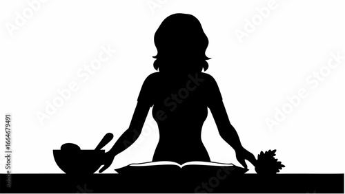 Silhouette of a woman reading a cookbook with a bowl of food and a plant on the table in black and white