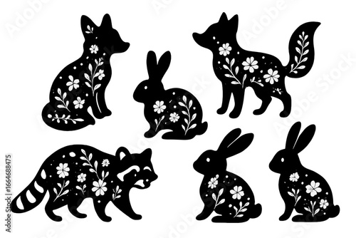Cute forest animal silhouettes with floral folk design. Vector set with fox, rabbit, raccoon. Black and white Scandinavian style woodland creatures for nursery, logo, sticker.