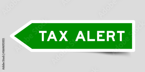 Green color arrow shape sticker label with word tax alert on gray background