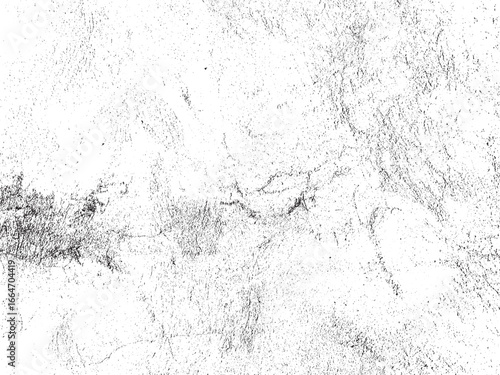 A distressed white concrete wall, aged and weathered, shows a network of black cracks and an interesting mottled texture. Great for backgrounds and overlays.