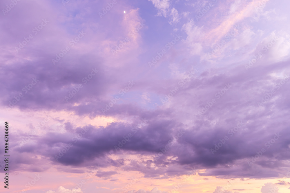 Obraz premium Clouds and purple sky in the morning background,Dramatic sunrise, sunset pink violet sky with clouds background texture