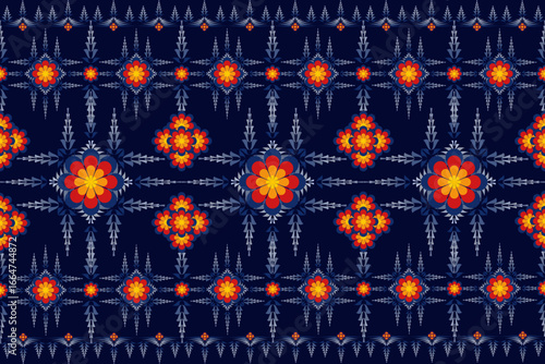 A native-style digital print fabric features intricate, symmetrical floral and graphic motifs on a navy blue background, perfect for unique and standout designs.