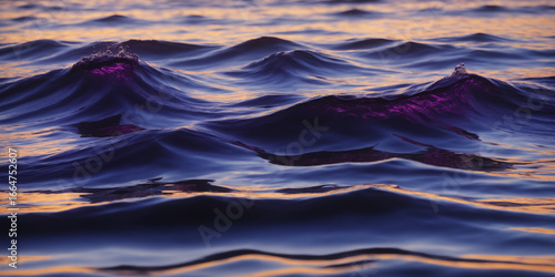 Serene Sunset Glow Reflecting on Ocean With Vibrant Purple Waves