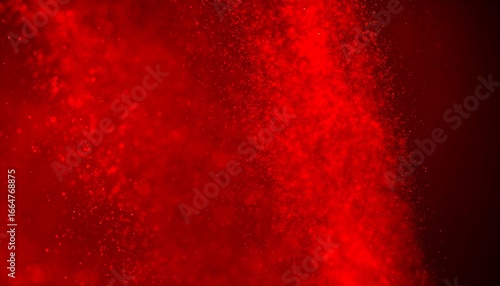 A dynamic, vibrant red abstract display of particles against a dark background, exhibiting a dramatic visual effect.
