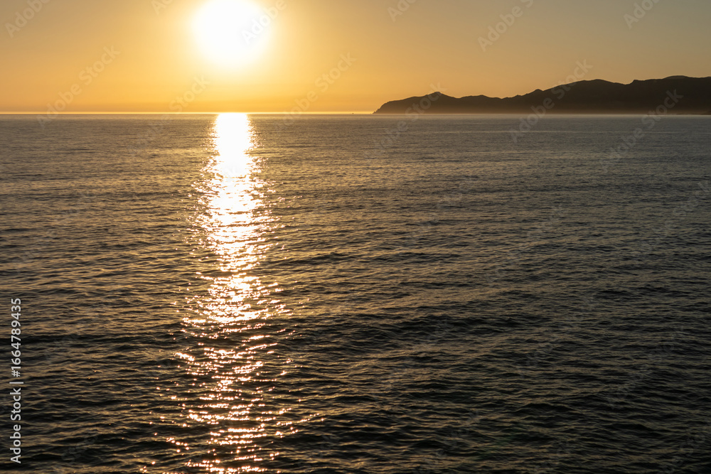 Obraz premium Sunset on Cane Malu Beach in Bosa, Sardinia