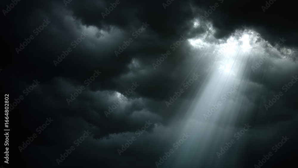 Obraz premium Sunlight piercing a dark sky filled with clouds.