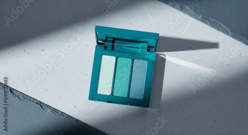 Teal Eyeshadow Compact on Minimalist Blue Concrete Surface, Soft Natural Light, Ample Copy Space for Beauty and Wellness Brands