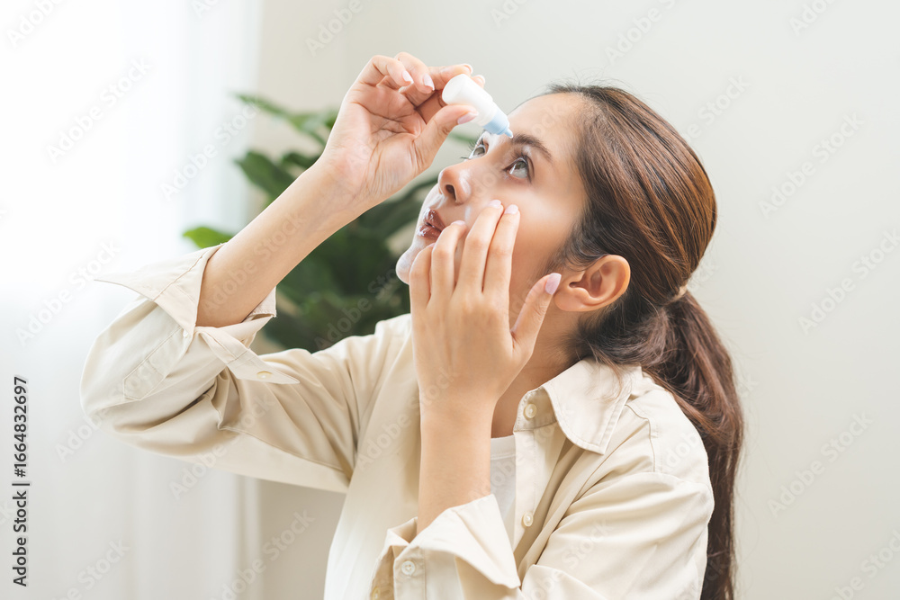 Health care concept, eye problem asian young woman applying, using medical eye drops to treat dry eye and irritation, suffering from irritated eye dry eyes or inflammation, allergy optical symptom. Health care concept, eye problem asian young woman applying, using medical eye drops to treat dry eye and irritation, suffering from irritated eye dry eyes or inflammation, allergy optical symptom.