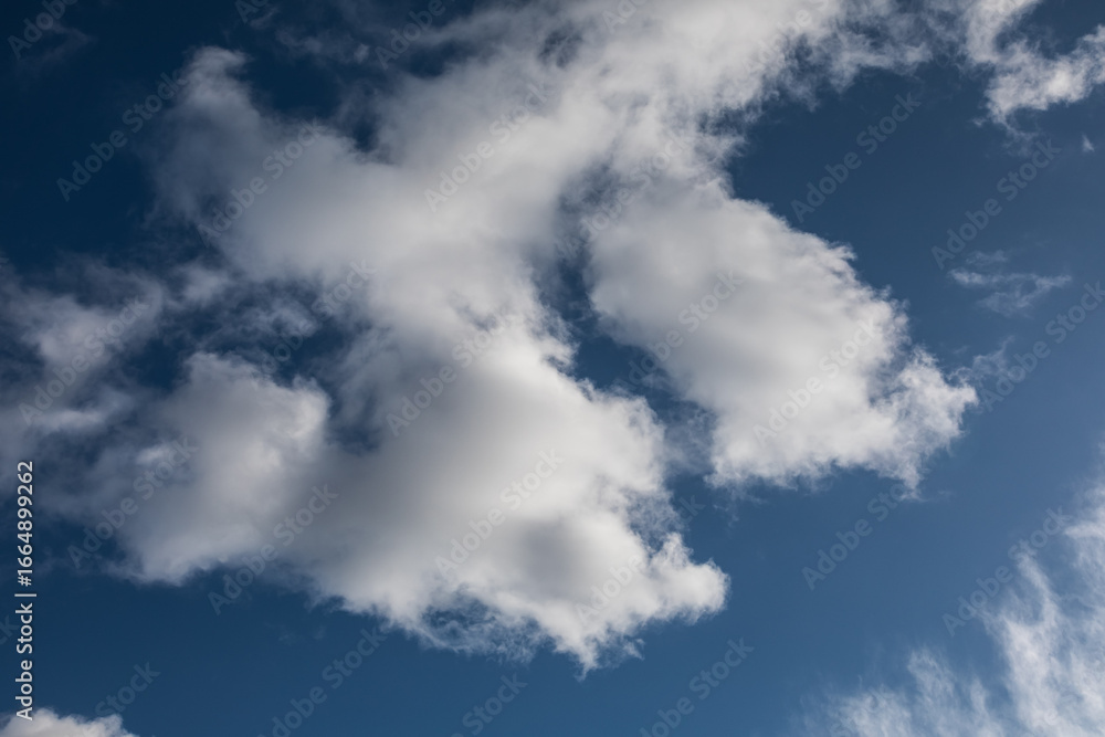 Fototapeta premium Dark blue sky with clouds at early evening 