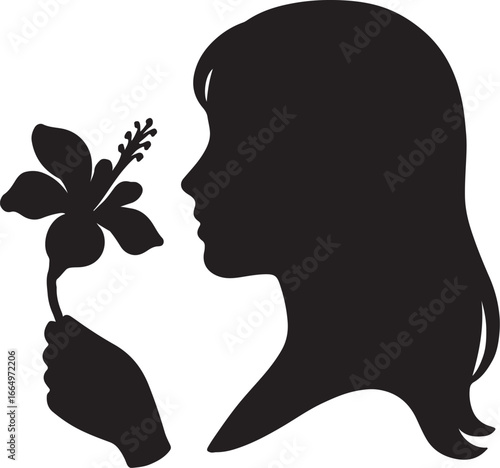A young girl is smelling the cotton flowers.  যুবতি মেয়ে তুলা ফুলের গ্রাণ নিচ্ছে