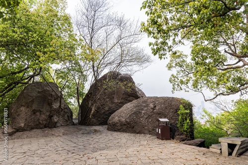 The serene peak of Boshi Hill in Hangzhou with large bolder or rock overlooking the West Lake, Hangzhou China