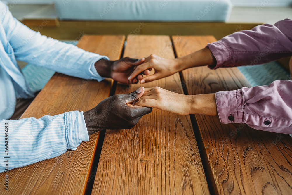 Fototapeta premium Handshake between people of different ethnicities, symbolizing trust, harmony, belonging, and unity