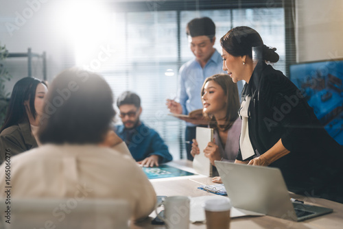 Leader business mature woman asian working together traning team skill positive emotion at modern office