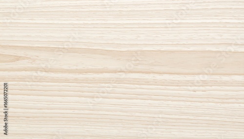 A close-up view of a light beige wood grain texture, exhibiting a smooth and subtle pattern.