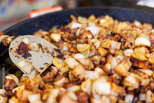 Sautéed meat and onions in pan — cozy autumn cooking with rustic flavor and smart food-tech inspiration