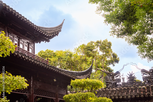 Photography Traditional chinese architecture among trees of Yu garden in Shanghai, China