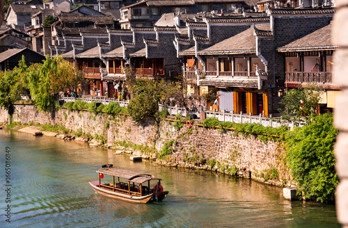 Fenghuang ancient town, China. Traditional chinese wooden houses in old watertown
