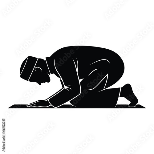 Silhouette of a muslim man praying on a prayer mat in a traditional pose silhouette