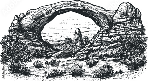 Dramatic Arch Rock Formation in arid landscape with desert flora