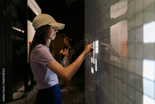 Woman using interactive digital screen