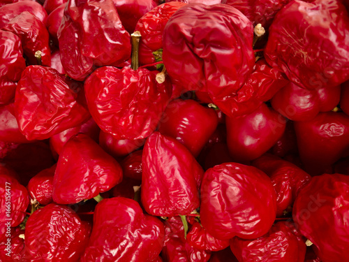 macro of large quantity of vivid and bright Calabrian chillies
