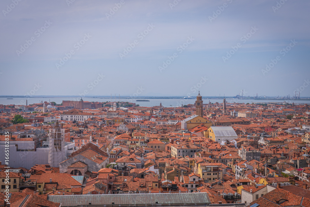Fototapeta premium Panoramic view over Venetian rooftops and lagoon