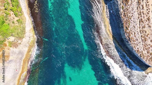4K drone video of Kadırga Bay with its turquoise sea and magnificent rocks in Agva-Sile in Istanbul, Turkiye.