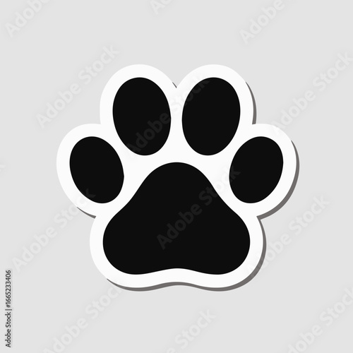 A charming black and white paw print sticker, isolated on white background, perfect for pet lovers, animalthemed projects, or adding a touch of playful charm to any design