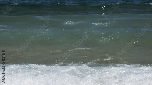 Slow motion ocean waves crashing on shore. Relaxing nature footage.