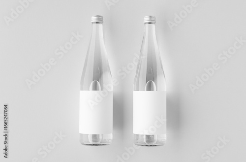 Water bottle mockup with blank label, clear glass